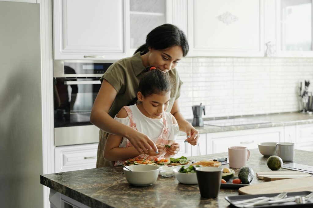 Mom and kids in Toronto kitchen budget hacks